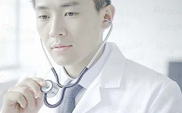 Doctor using a stethoscope - Medical device registration and filing consultation